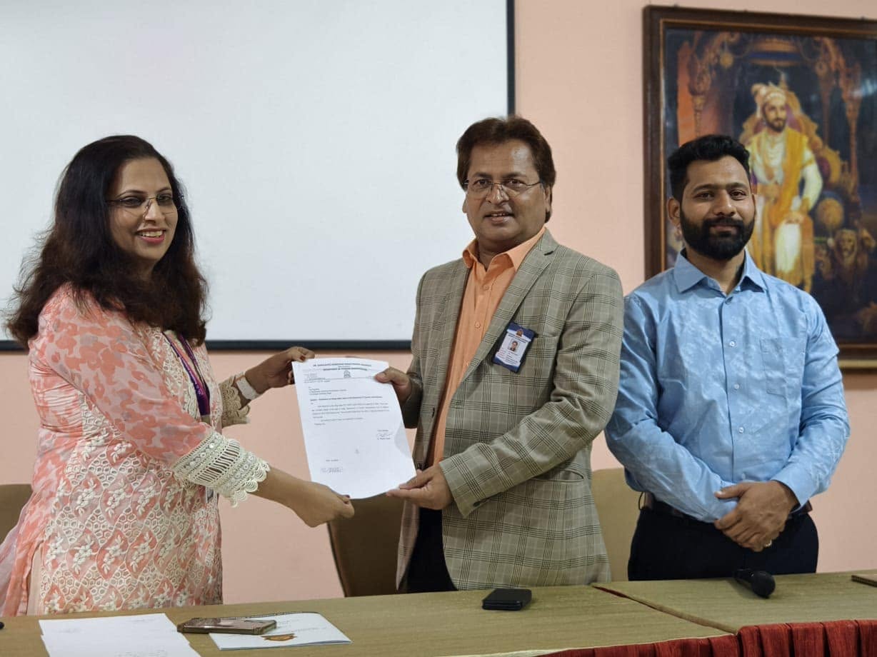 Dr Rajesh Ragde presenting an academic document