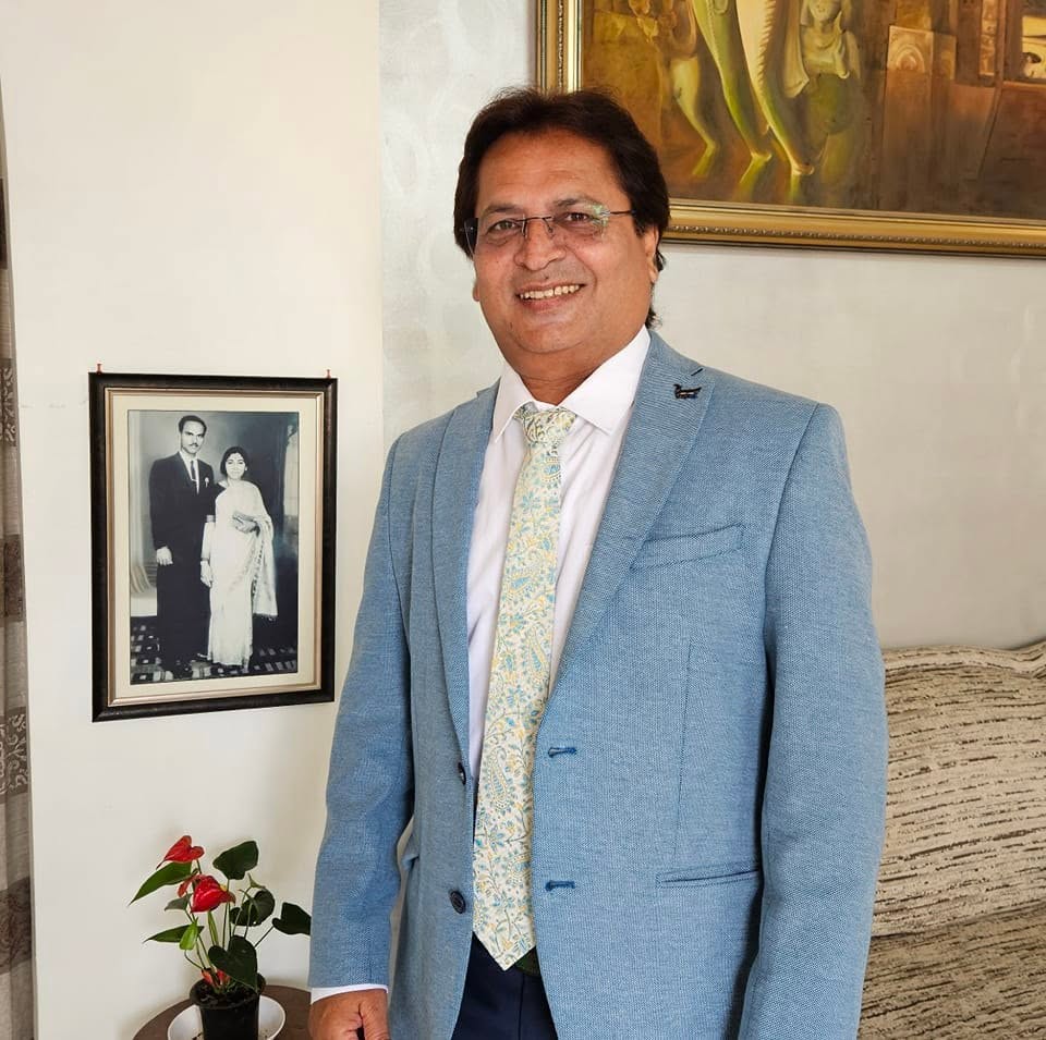 Dr Rajesh Ragde in a formal blue suit